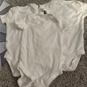 NWOT 0-3M white carters onesies
